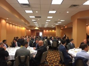 Participants discuss institutional investment topics over lunch.